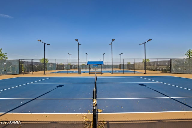 view of sport court with basketball hoop