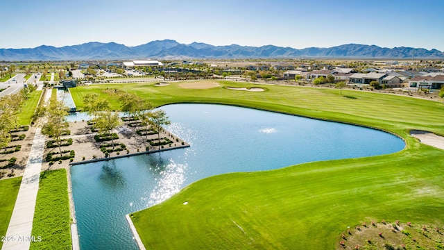 view of community with a water and mountain view