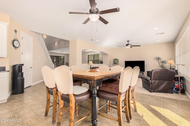 dining area featuring light tile patterned flooring and ceiling fan