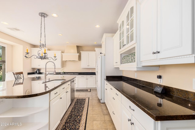 kitchen with white cabinets, a center island with sink, dishwasher, pendant lighting, and sink