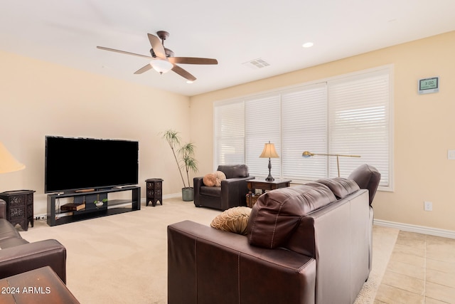 living room with light colored carpet and ceiling fan