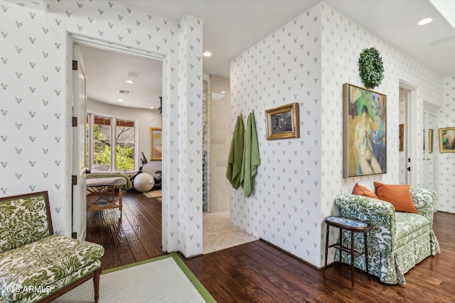 interior space with recessed lighting, wood-type flooring, visible vents, and wallpapered walls