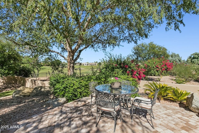 view of patio featuring fence