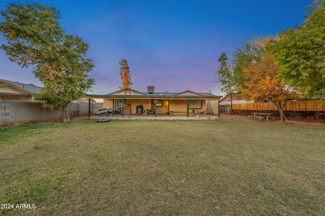6415 W Roosevelt St, Phoenix, AZ 85043 - rear view of house featuring a patio area