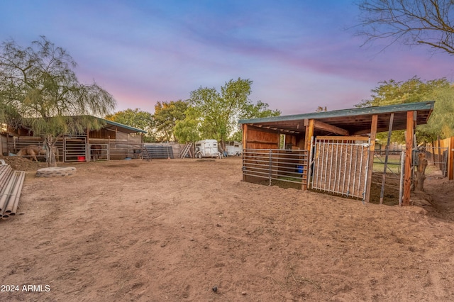 6415 W Roosevelt St, Phoenix, AZ 85043 - yard at dusk featuring an exterior structure and an outbuilding