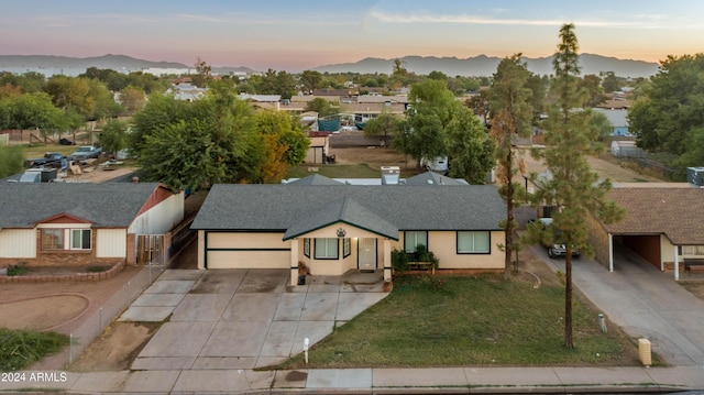 6415 W Roosevelt St, Phoenix, AZ 85043 - aerial view at dusk of a mountain view and a residential view