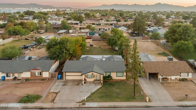 6415 W Roosevelt St, Phoenix, AZ 85043 - aerial view at dusk of a residential view and a mountain view