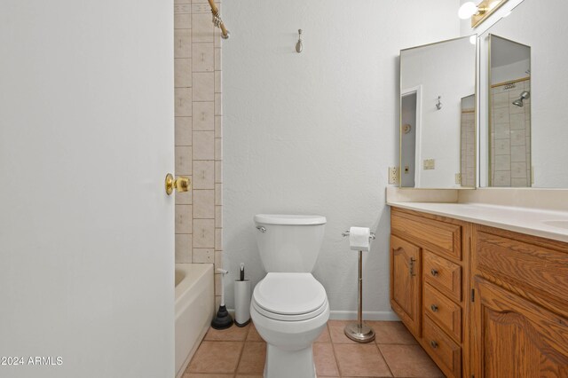 6415 W Roosevelt St, Phoenix, AZ 85043 - full bathroom featuring vanity, toilet, tile patterned floors, and bathtub / shower combination