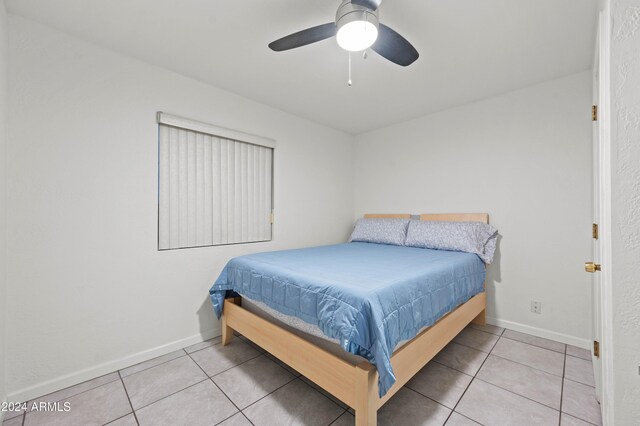 6415 W Roosevelt St, Phoenix, AZ 85043 - bedroom featuring tile patterned floors, baseboards, and a ceiling fan