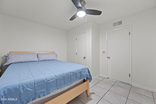 6415 W Roosevelt St, Phoenix, AZ 85043 - bedroom with light tile patterned floors, baseboards, and ceiling fan