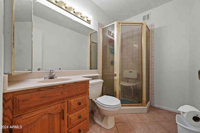 6415 W Roosevelt St, Phoenix, AZ 85043 - full bath with a stall shower, vanity, toilet, tile patterned flooring, and baseboards