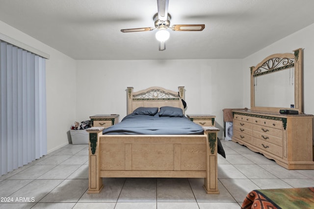 6415 W Roosevelt St, Phoenix, AZ 85043 - bedroom featuring light tile patterned floors and ceiling fan