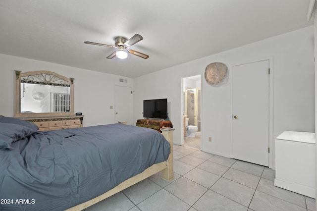 6415 W Roosevelt St, Phoenix, AZ 85043 - bedroom with light tile patterned flooring, ensuite bathroom, ceiling fan, and fridge