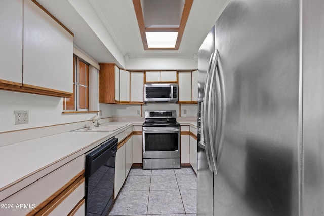 6415 W Roosevelt St, Phoenix, AZ 85043 - kitchen with appliances with stainless steel finishes, light countertops, a sink, white cabinets, and light tile patterned flooring