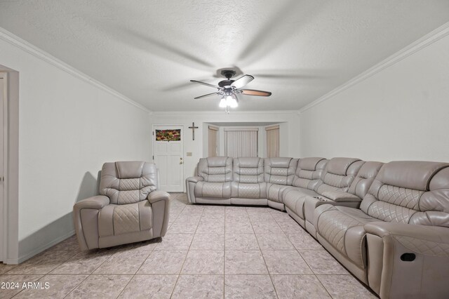 6415 W Roosevelt St, Phoenix, AZ 85043 - living area featuring a ceiling fan, crown molding, light tile patterned flooring, and a textured ceiling