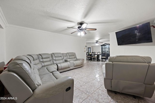 6415 W Roosevelt St, Phoenix, AZ 85043 - living room featuring ceiling fan, ornamental molding, light tile patterned floors, and a textured ceiling