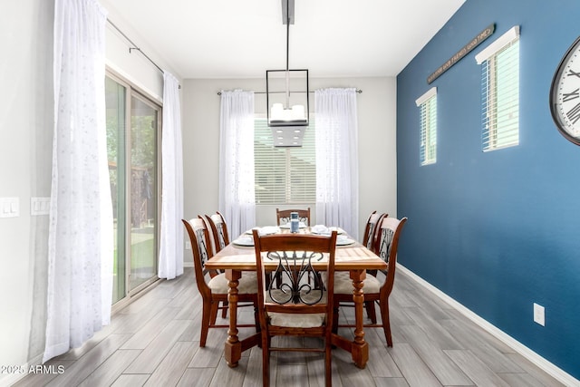 dining area featuring wood finish floors and baseboards