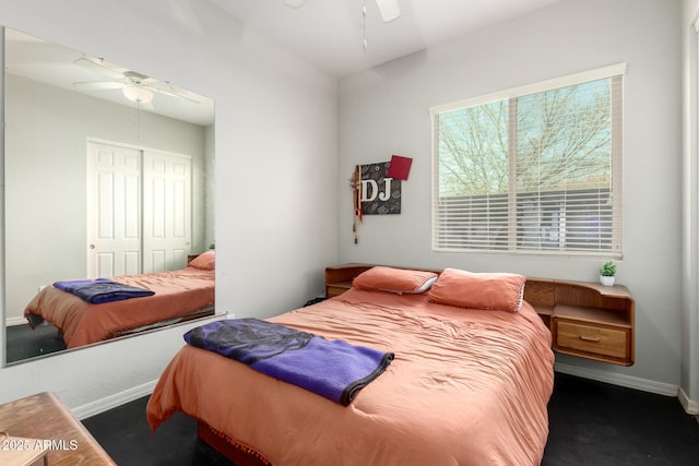 bedroom with a closet, baseboards, and ceiling fan