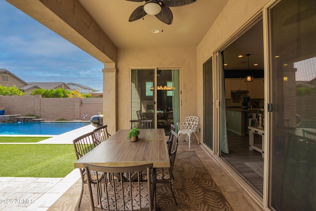 view of patio with ceiling fan, a fenced in pool, and fence private yard