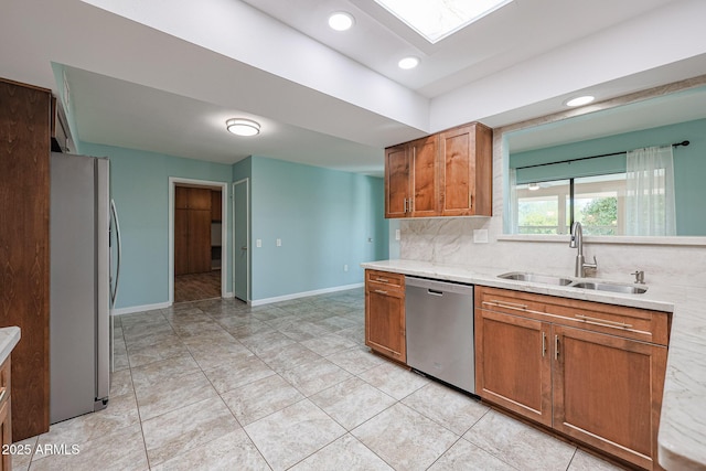 kitchen featuring light tile patterned flooring, appliances with stainless steel finishes, tasteful backsplash, and sink