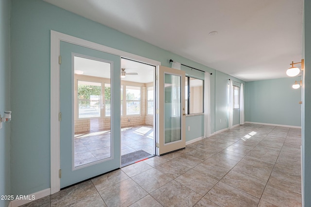 interior space featuring french doors and ceiling fan