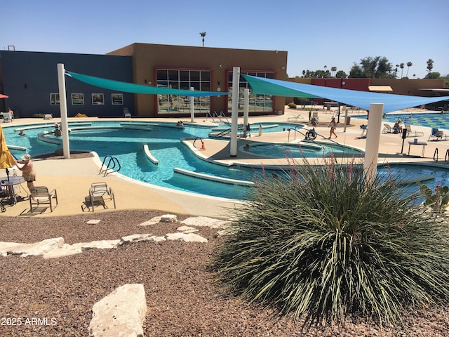 view of pool featuring a patio