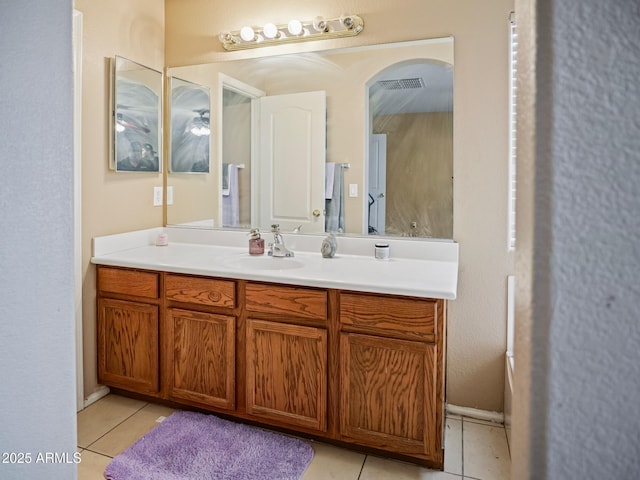 bathroom with tile patterned floors and vanity