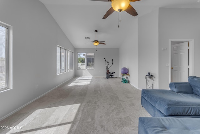 unfurnished living room with high vaulted ceiling, light carpet, visible vents, and baseboards