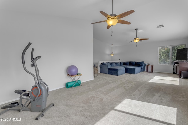 exercise area featuring vaulted ceiling, carpet floors, visible vents, and baseboards