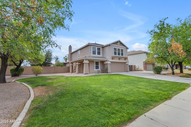 view of front of house with a garage, concrete driveway, fence, a front yard, and stucco siding