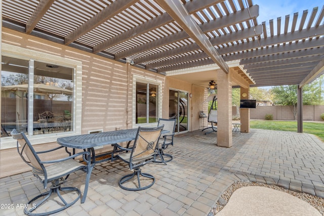 view of patio featuring fence, outdoor dining area, and a pergola