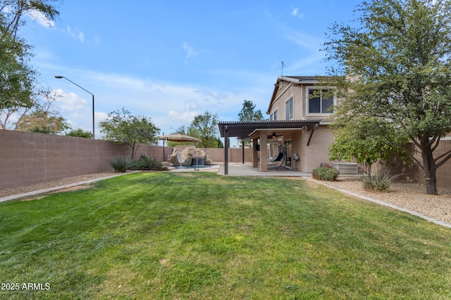 view of yard with a patio area, a fenced backyard, ceiling fan, and a pergola