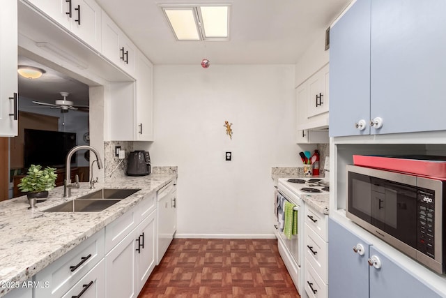 kitchen featuring sink, white cabinetry, electric range, dark parquet flooring, and light stone countertops