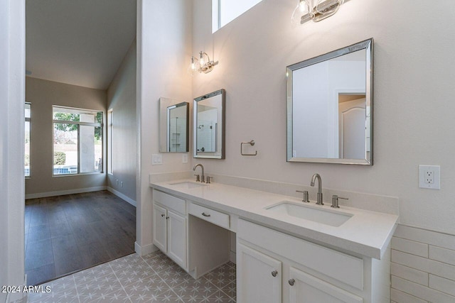 bathroom with hardwood / wood-style flooring and vanity