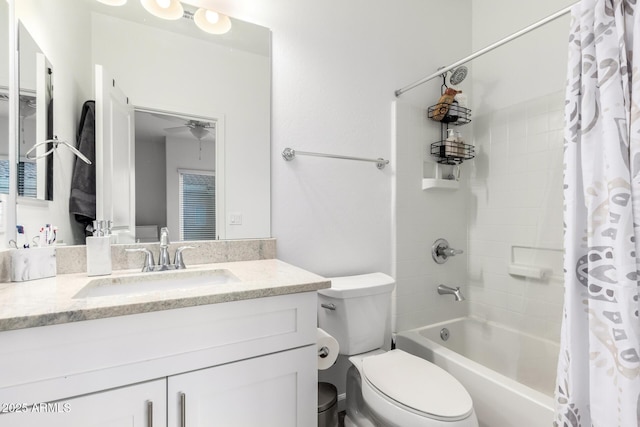 bathroom featuring ceiling fan, vanity, toilet, and shower / bath combo with shower curtain