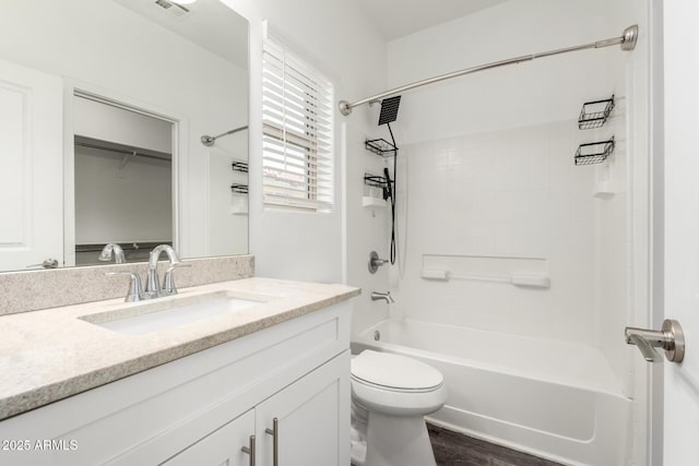 full bathroom with toilet, shower / tub combination, visible vents, and vanity