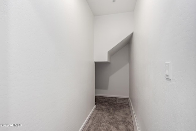 corridor featuring carpet and baseboards
