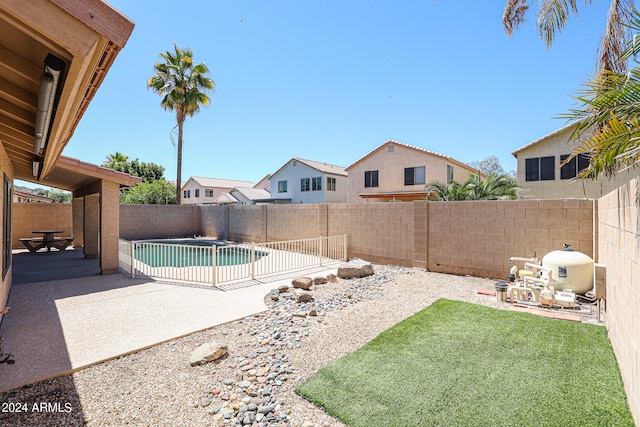 exterior space with a patio and a fenced in pool