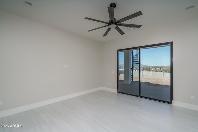 unfurnished room with ceiling fan