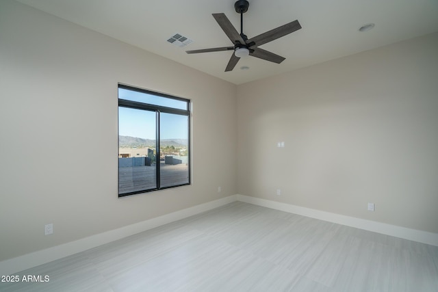 empty room featuring ceiling fan