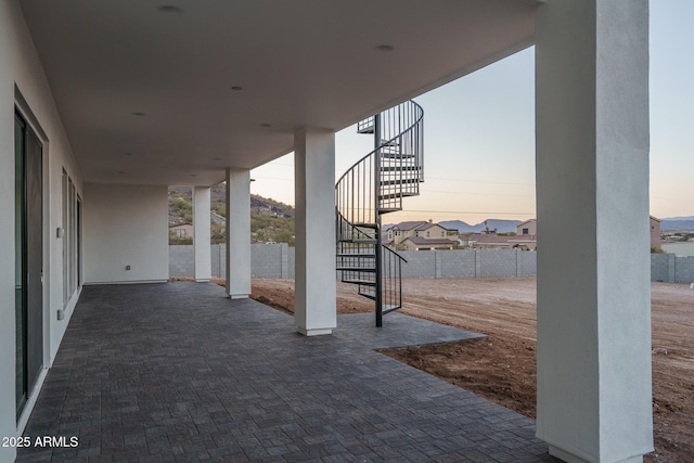 view of patio terrace at dusk