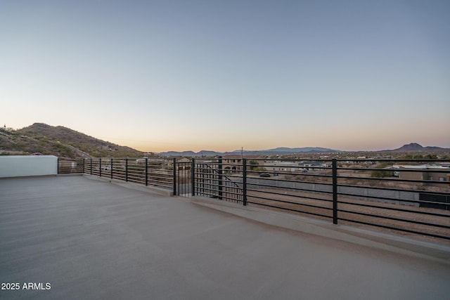 patio terrace at dusk with a mountain view