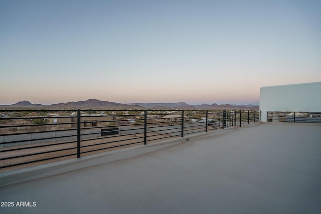 patio terrace at dusk with a mountain view