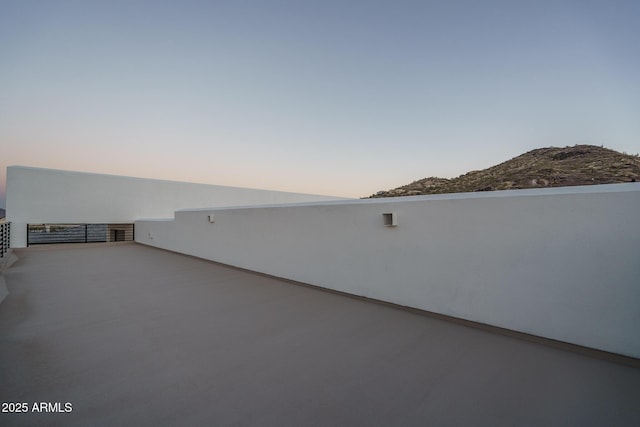 view of patio terrace at dusk