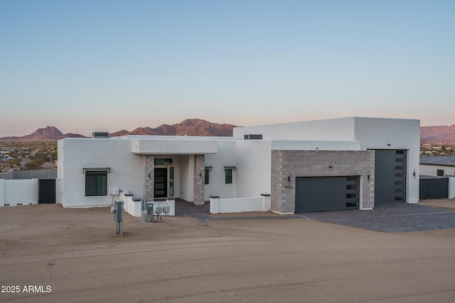 view of front facade featuring a mountain view and a garage