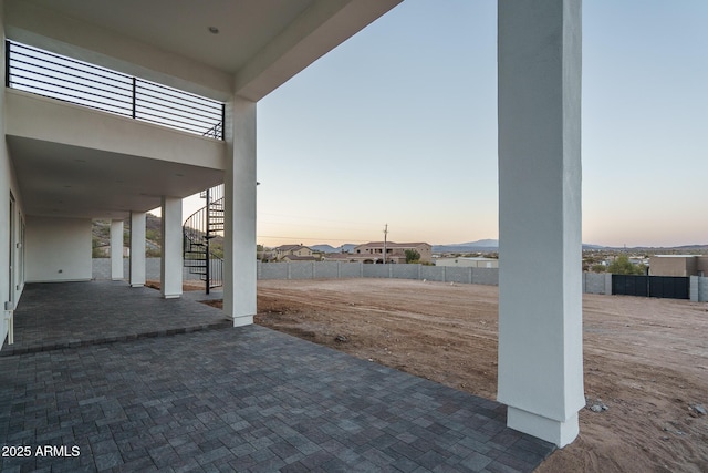 view of patio terrace at dusk