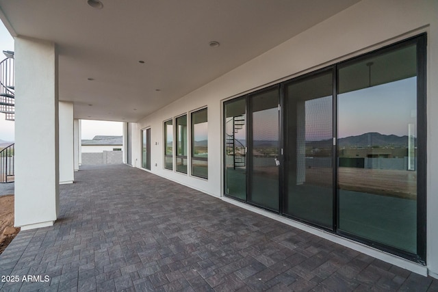 view of patio terrace at dusk