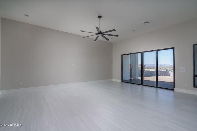 spare room with ceiling fan