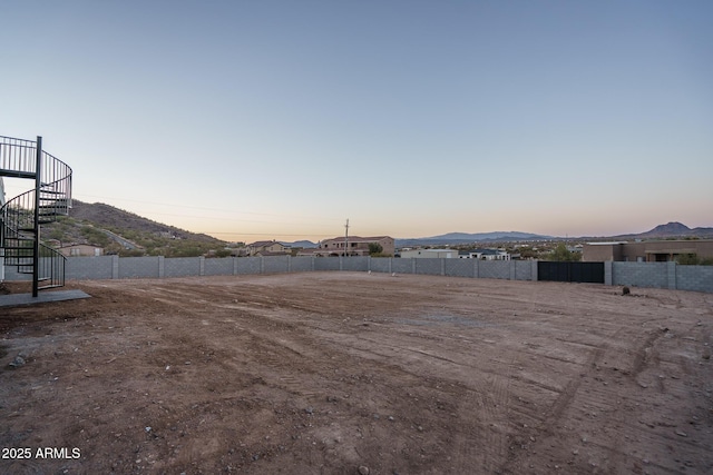 yard at dusk with a mountain view