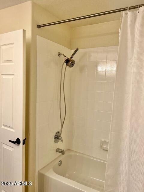 full bathroom with shower / bathtub combination with curtain